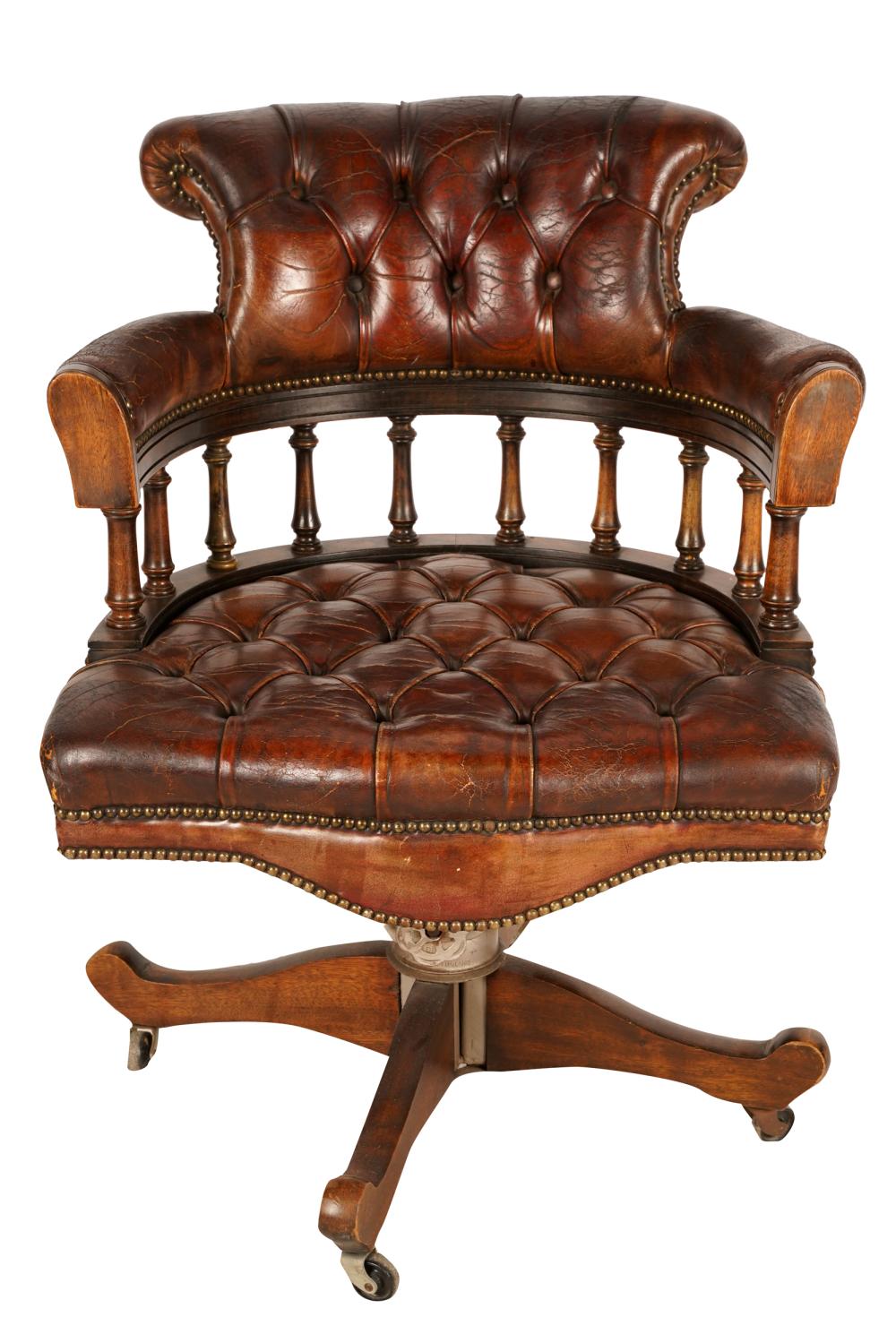 Appraisal: LEATHER WOOD SWIVEL CHAIRwith label Reg'd Trade MarkHillcrest Chair Actions