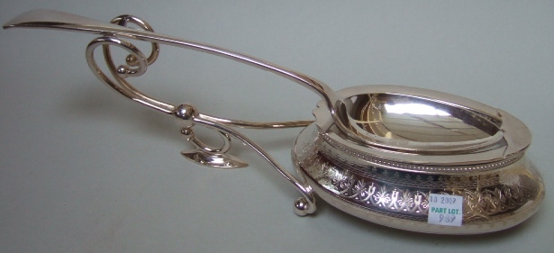 Appraisal: A plated spoon warmer the stand of oval form with