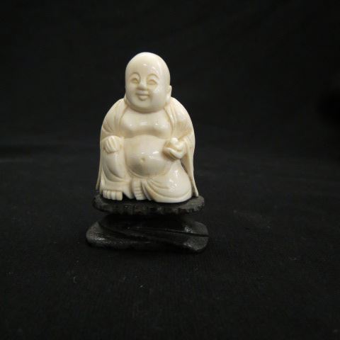 Appraisal: Carved Ivory Figurine of a Seated Buddha plus wooden base