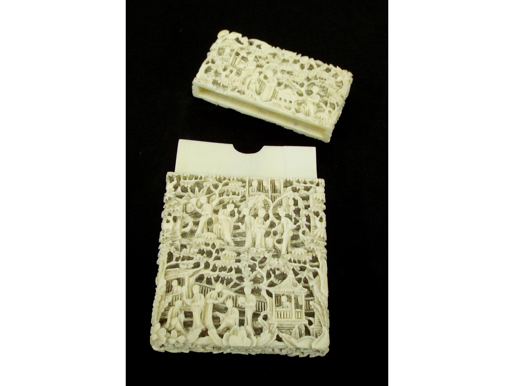 Appraisal: Canton carved ivory card case decorated in relief with various