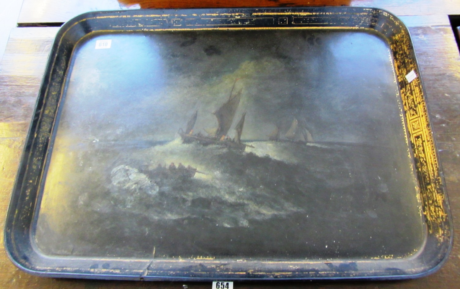 Appraisal: A th century papier mache tray painted with boats in