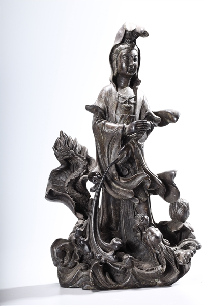 Appraisal: Chinese bronze Guanyin standing atop a dragon x x approx