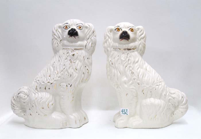 Appraisal: PAIR ENGLISH STAFFORDSHIRE PORCELAIN DOGS in opposing positions each with