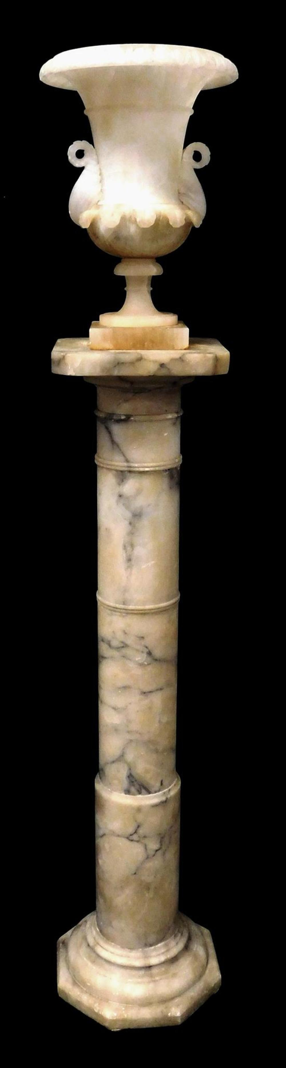 Appraisal: White alabaster urn with pedestal urn has drainage hole carved