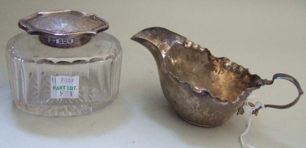 Appraisal: A silver small sauceboat with a shaped rim and with