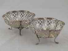 Appraisal: A pair of pierced bonbon dishes each on three feet