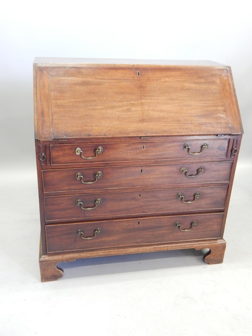 Appraisal: A George III mahogany bureau the fall and close with