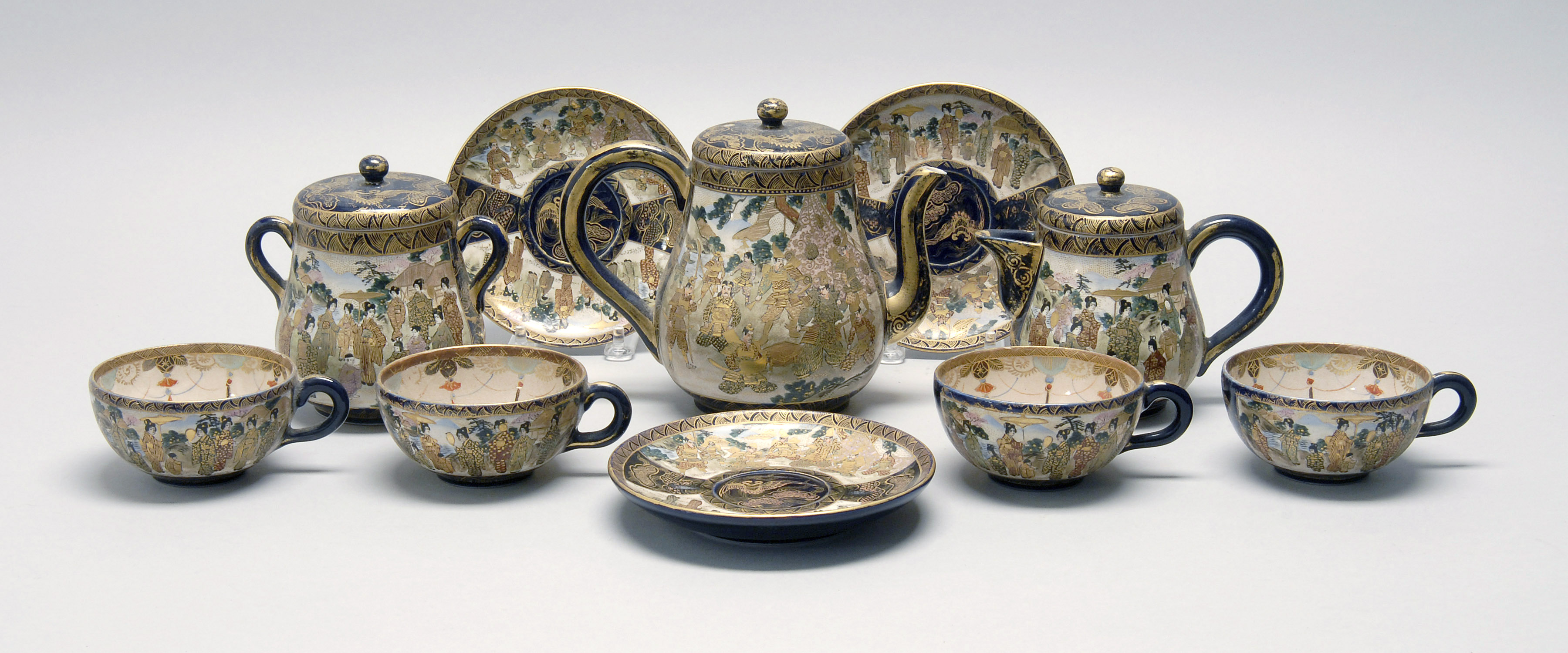 Appraisal: SATSUMA POTTERY TEA SET Meiji PeriodA teapot creamer sugar four