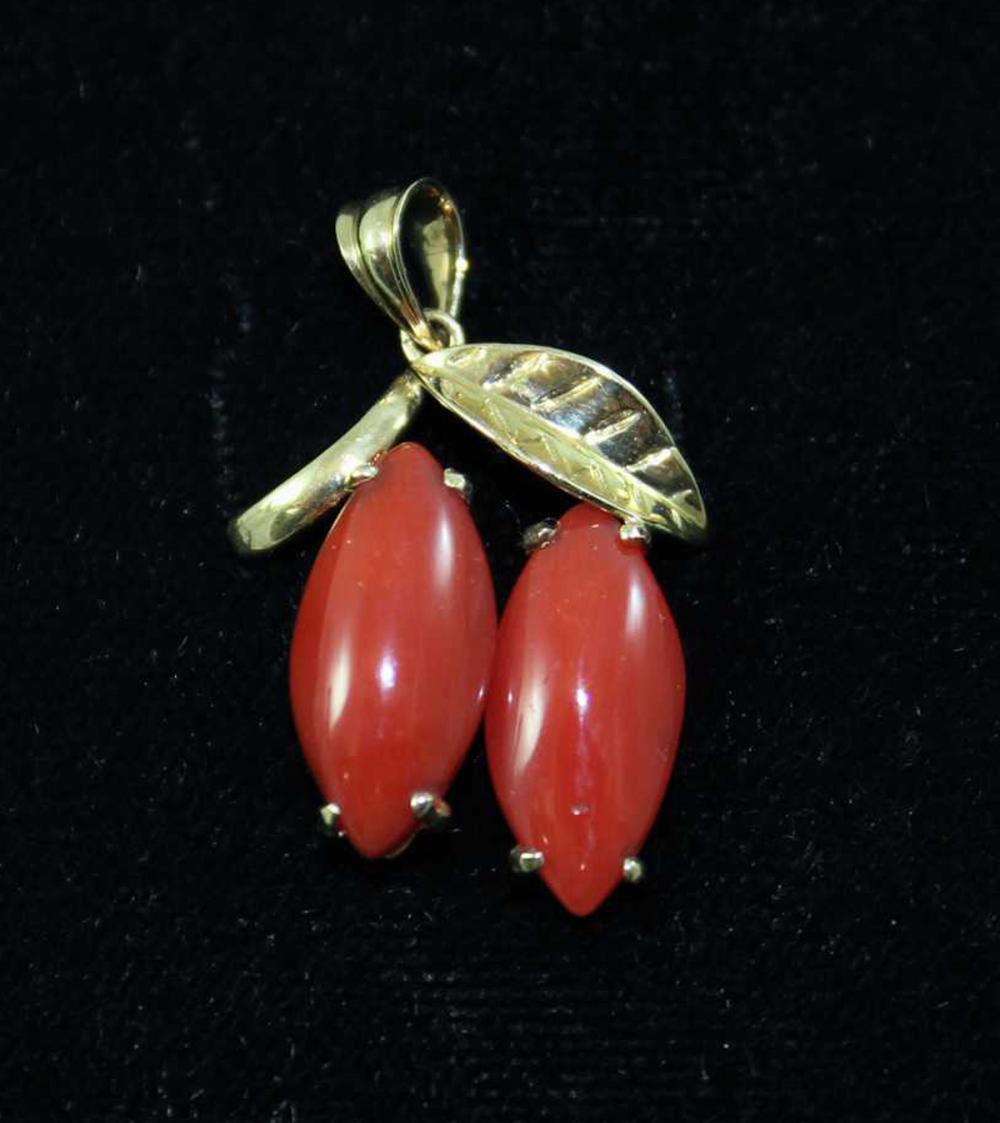 Appraisal: CORAL AND FOURTEEN KARAT GOLD PENDANT with a yellow gold