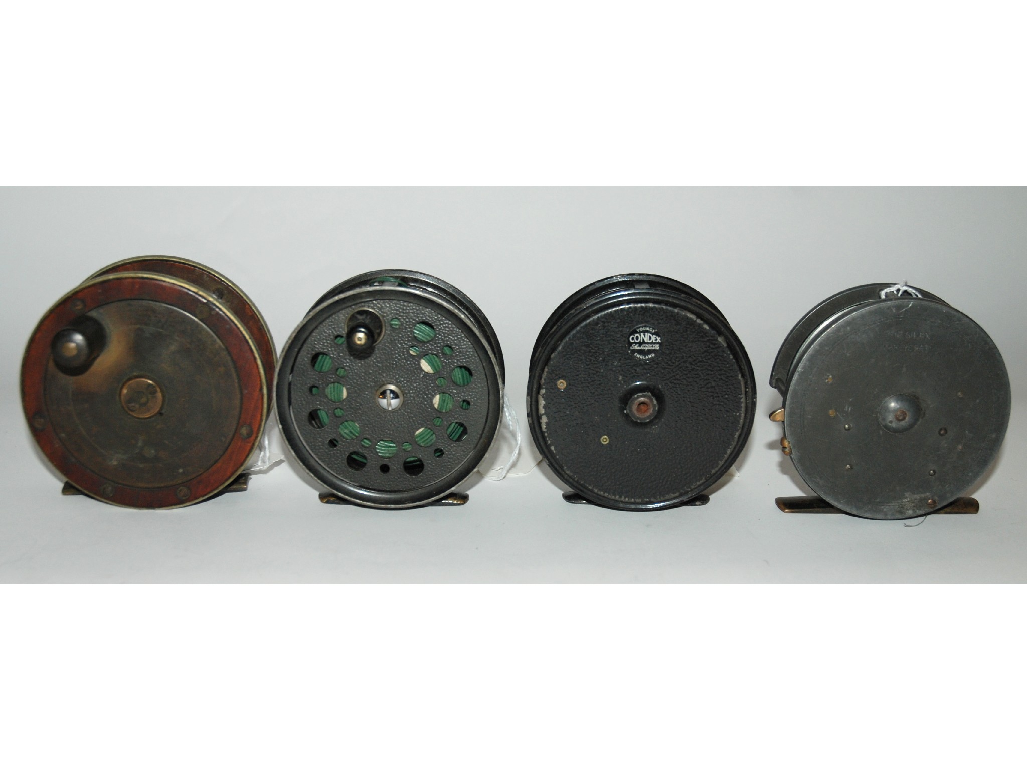 Appraisal: Four various fishing reels including Hardy patent Silex alloy reel