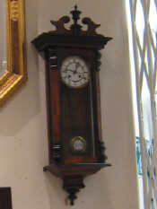 Appraisal: A mahogany cased Vienna Regulator style wall clock