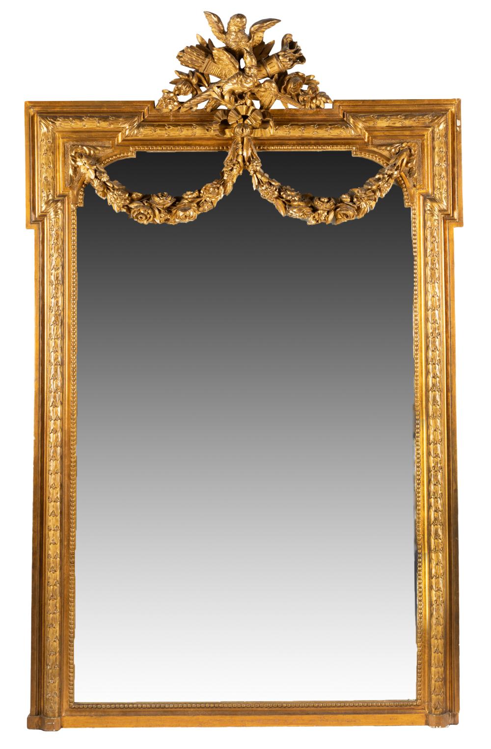 Appraisal: GILTWOOD WALL MIRRORthe flat mirror plate surmounted by a trophy