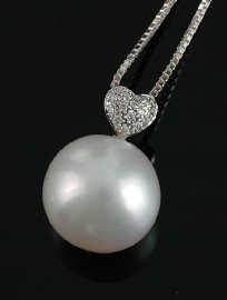 Appraisal: A South Sea pearl and diamond pendant The pearl of