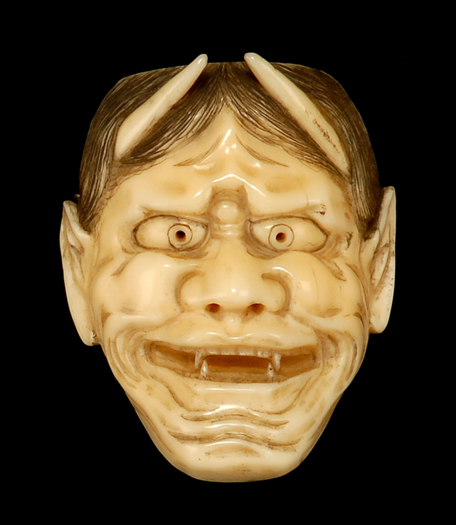 Appraisal: IVORY MASK NETSUKE OKIMONO Meiji PeriodDepicting Hannya with fierce expression