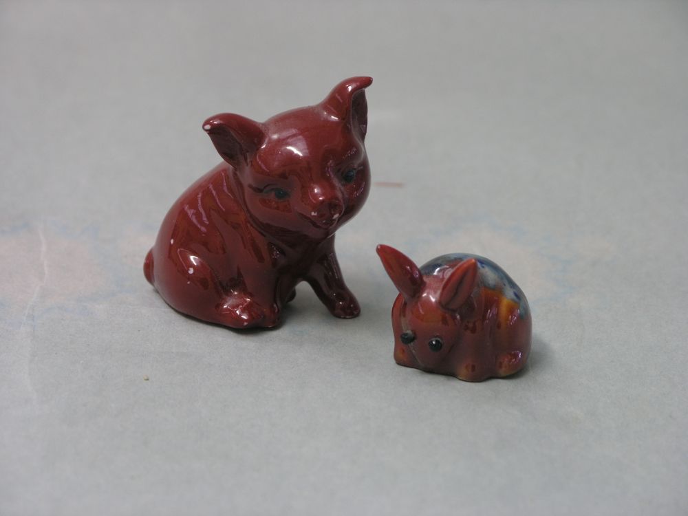 Appraisal: Two Bernard Moore flambe animals seated piglet in miniature rabbit