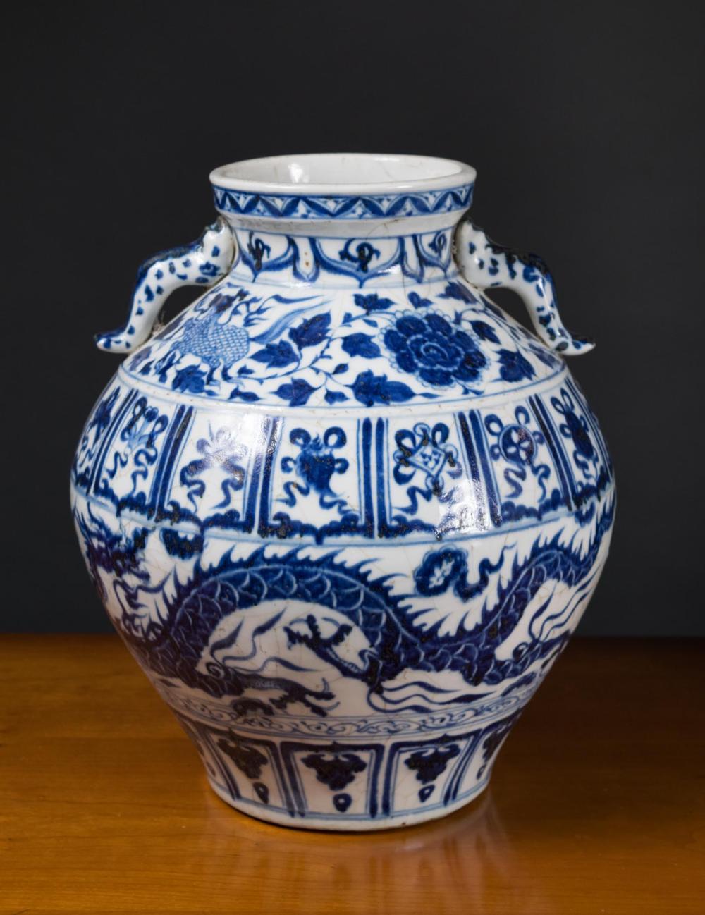 Appraisal: CHINESE BLUE AND WHITE JAR with applied scrolling handles at