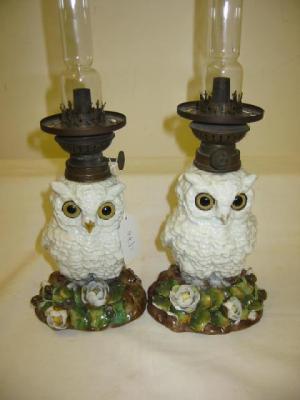 Appraisal: A PAIR OF VICTORIAN PORCELAIN OIL LAMPS modelled as white