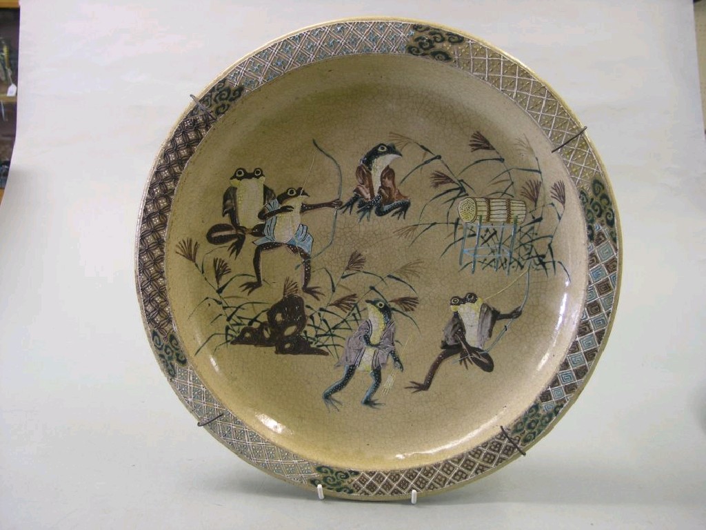 Appraisal: A Satsuma charger thickly enamelled with playful frogs in