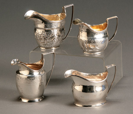 Appraisal: Group of Four George III Silver Cream Jugs The first