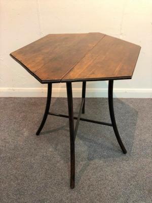 Appraisal: An early th Century folding fruitwood table the hexagonal two