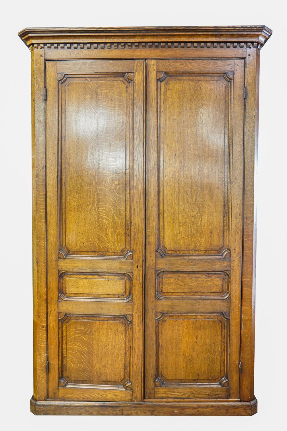 Appraisal: CONTINENTAL CARVED OAK ARMOIRECondition general marks scratches nicks fading shrinkage