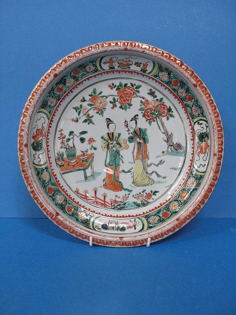 Appraisal: A CHINESE FAMILLE VERTE CHARGER decorated with figures beneath a