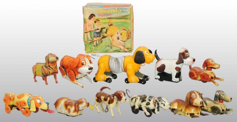 Appraisal: Lot of Tin Dog Friction Wind-Up Toys Description Japanese Moderate