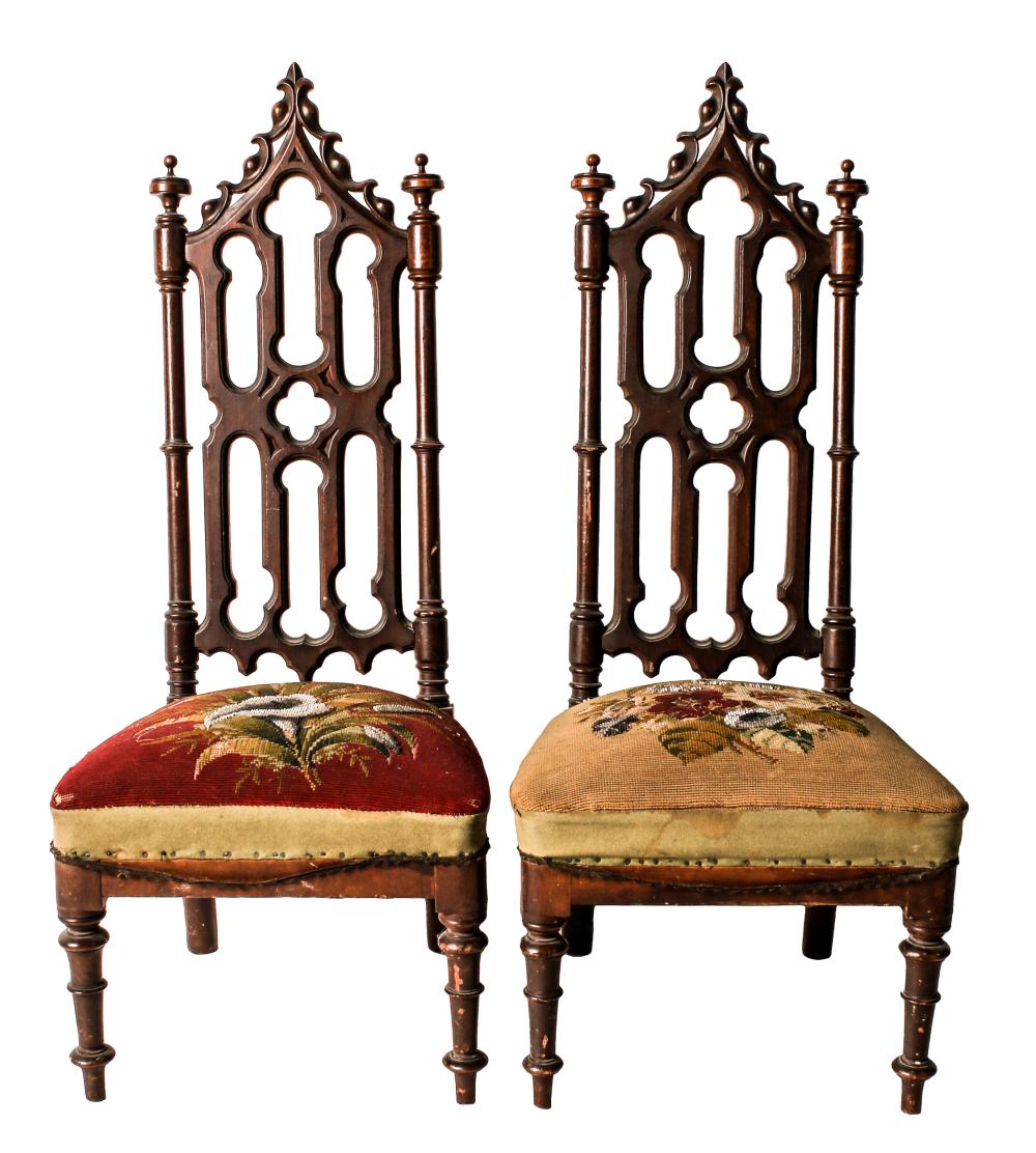 Appraisal: PAIR OF GOTHIC REVIVAL MAHOGANY LOW CHAIRSeach with needlework upholstery