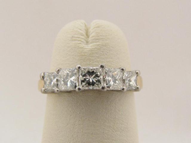 Appraisal: Lady's k yellow gold and platinum five stone princess cut