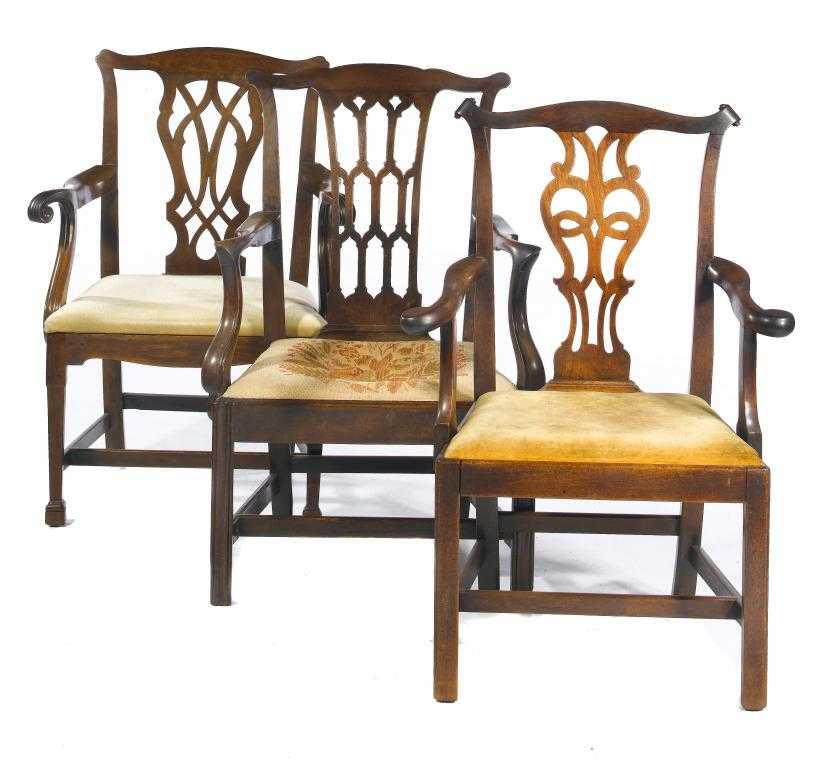 Appraisal: THREE GEORGE III MAHOGANY ELBOW CHAIRS with 'gothick' or interlaced