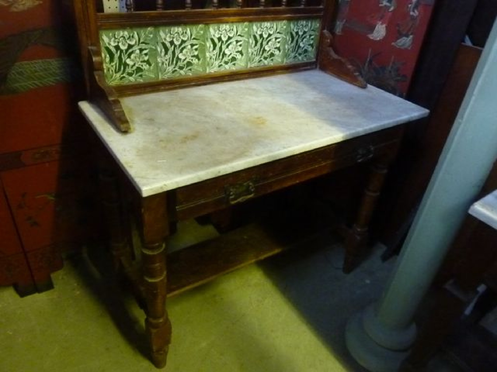 Appraisal: A th century washstand with white marble top the raised