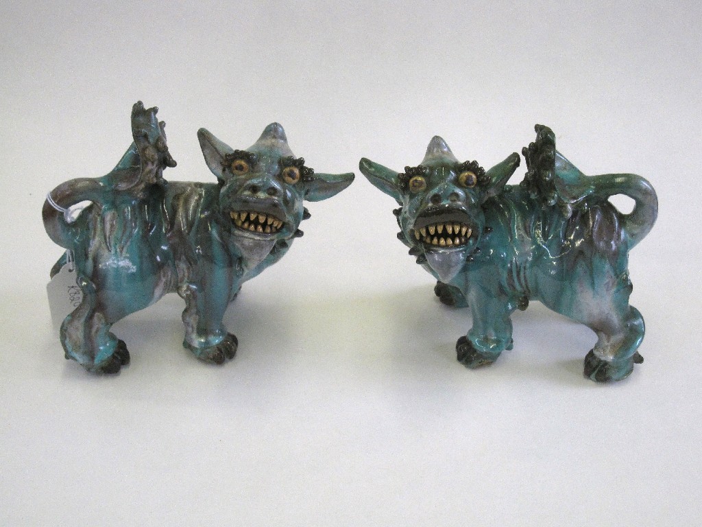 Appraisal: Pair of green glazed fo dogs