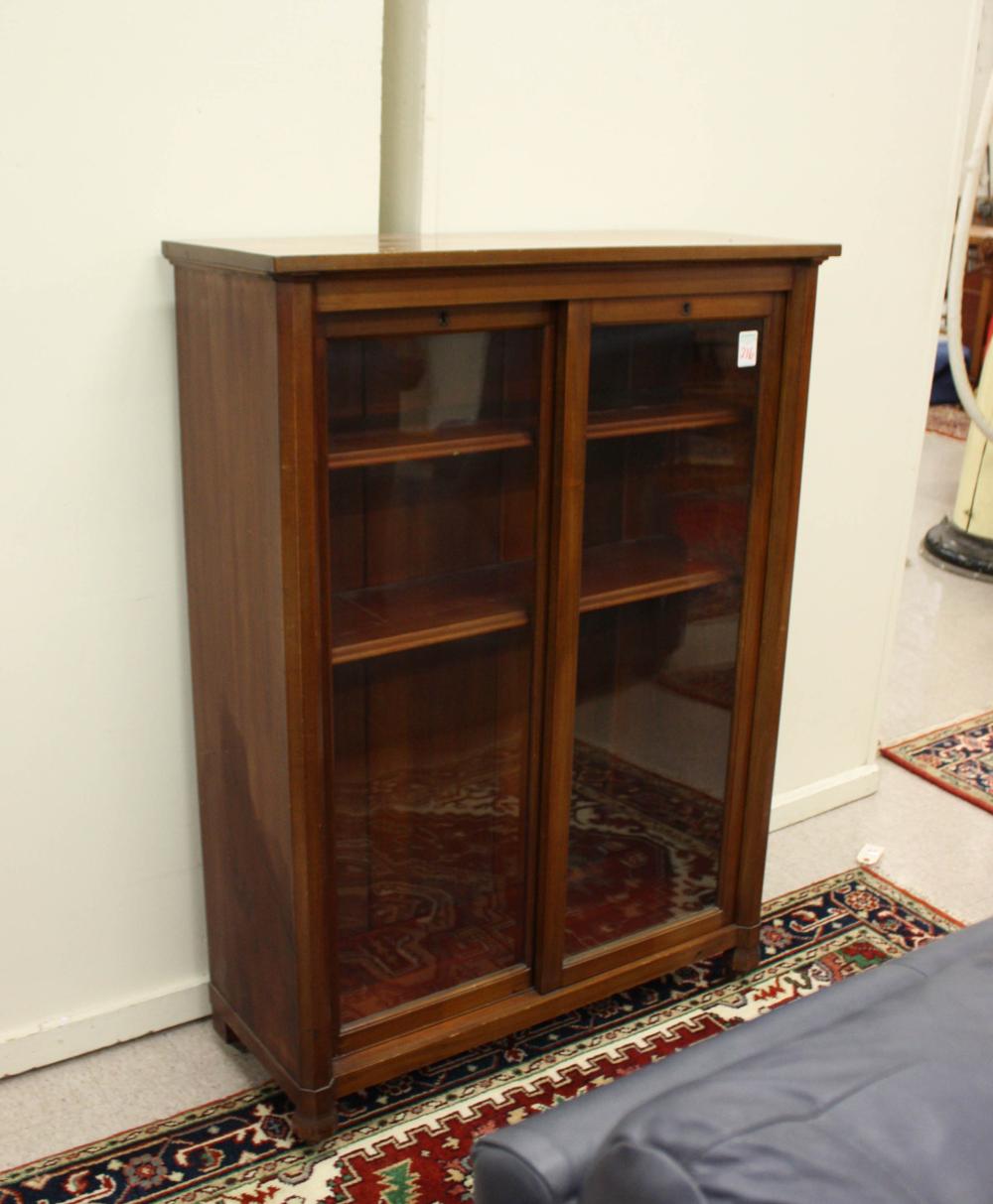 Appraisal: MAHOGANY CABINET BOOKCASE American early th century having three adjustable