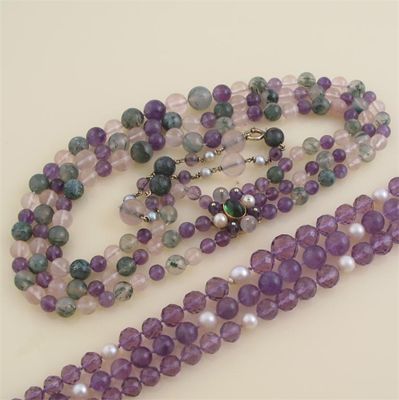 Appraisal: A three row graduated bead necklace Comprising moss agate amethyst