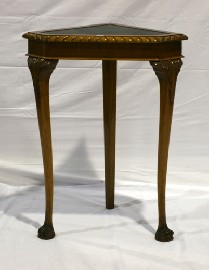 Appraisal: An early th century style corner table with tooled leather