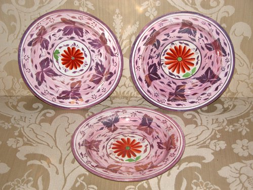 Appraisal: Title Pink Lustreware Plates with painted daisy decoration in center