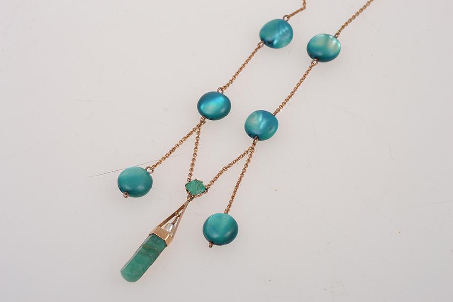 Appraisal: A MOTHER OF PEARL AND EMERALD DROP NECKLACE IN CT