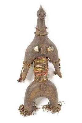 Appraisal: A Nigerian figure with applied leather beads and shells in