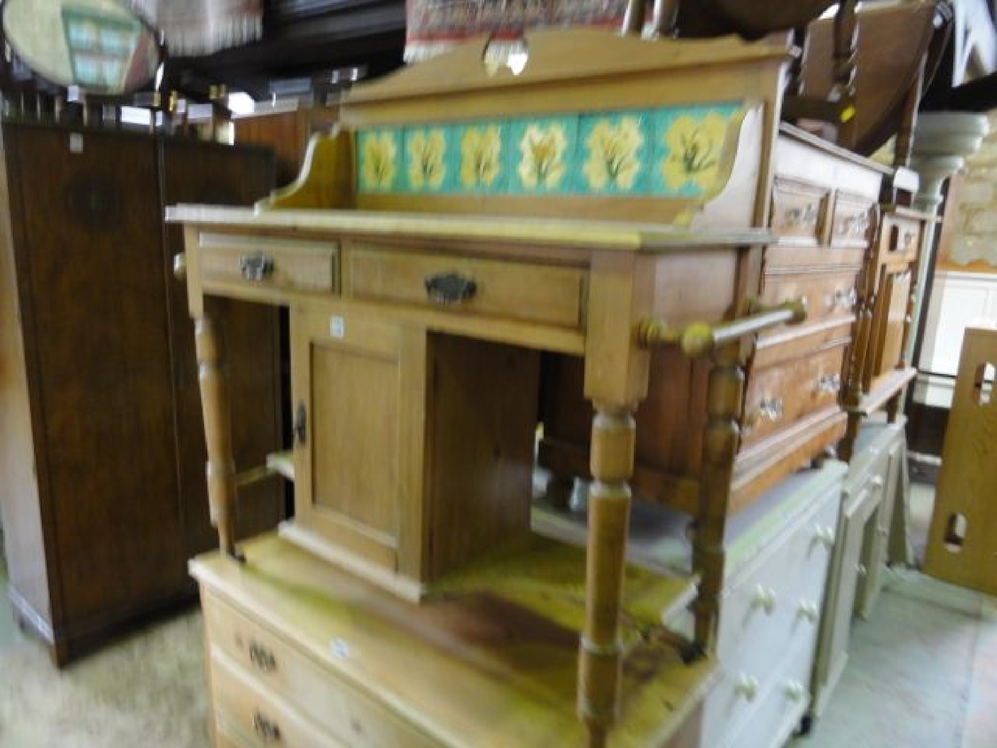 Appraisal: A late Victorian stripped pine washstand the raised back incorporating