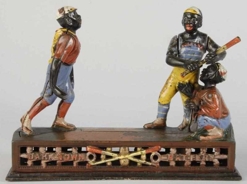 Appraisal: Cast Iron Dark Town Battery Mechanical Bank Description Manufactured by