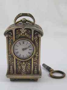 Appraisal: A French hallmarked silver miniature carriage clock by Boucheron signed