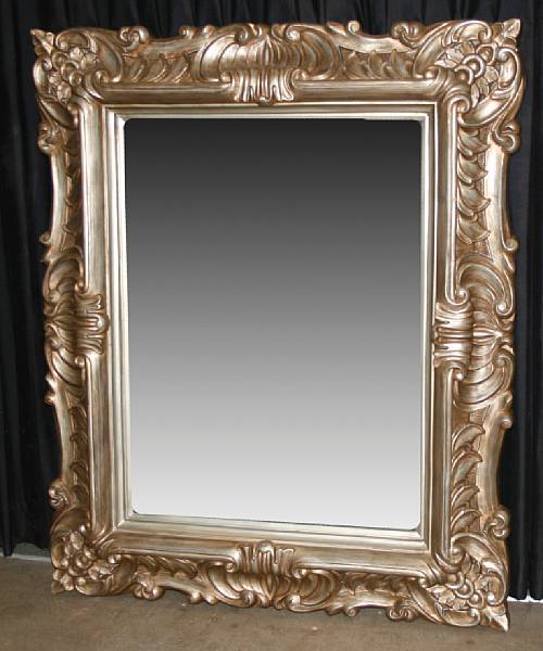 Appraisal: A Rococo style giltwood and gilt composition mirror