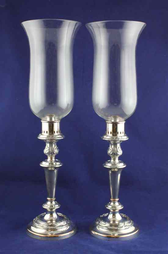 Appraisal: A pair of early th century Sheffield plated storm lamps