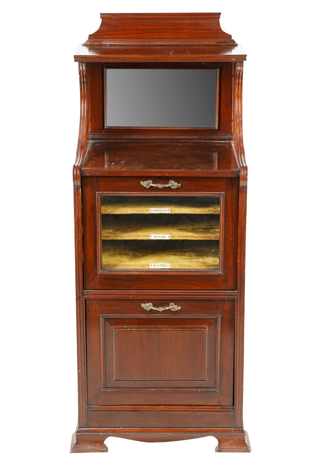 Appraisal: MUSIC CABINETthe upper hinged door opening to reveal three tiered