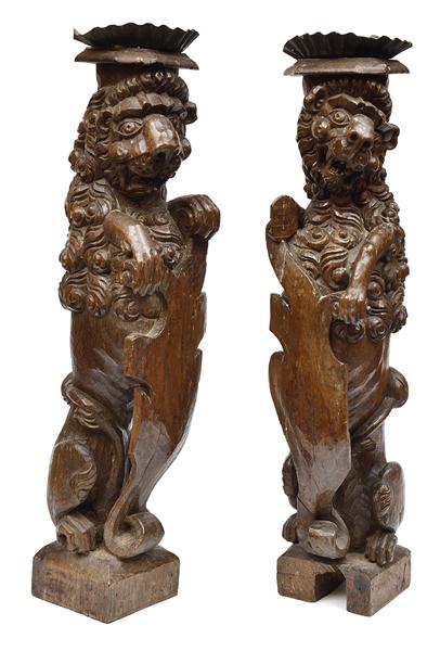 Appraisal: A PAIR OF TH CENTURY OAK TORCHERES CARVED AS RAMPANT