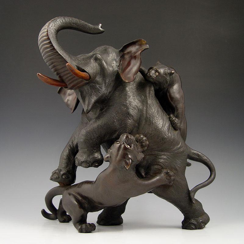 Appraisal: MEIJI PERIOD BRONZE TIGER ATTACK ON ELEPHANT Scene of tigers