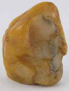 Appraisal: A Chinese yellow soapstone seal of irregular natural shape with