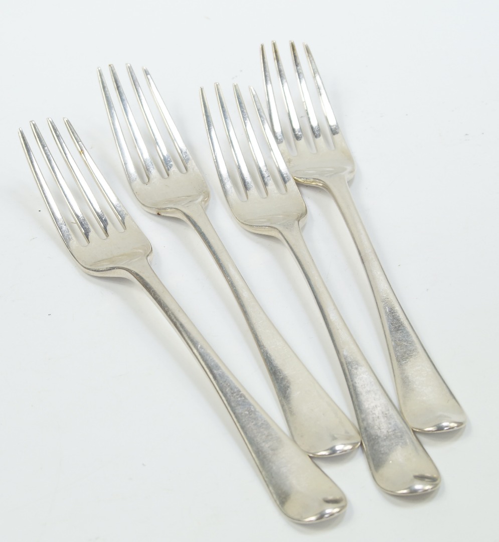 Appraisal: A set of four George III silver table forks decorated