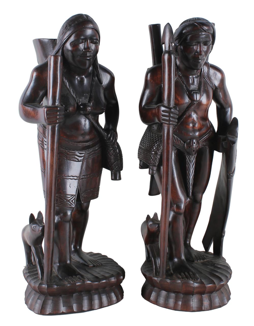 Appraisal: PAIR OF FILIPINO CARVED WALKING FIGURESebonized wood each inches high