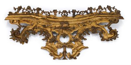 Appraisal: Two impressive French carved giltwood pediments th century The twin